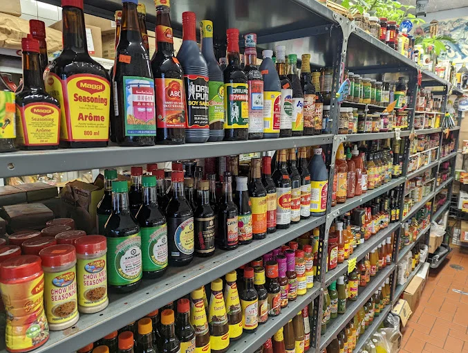 Shelves filled with sauces, seasonings, and specialty pantry goods inside Tony's Fish Market